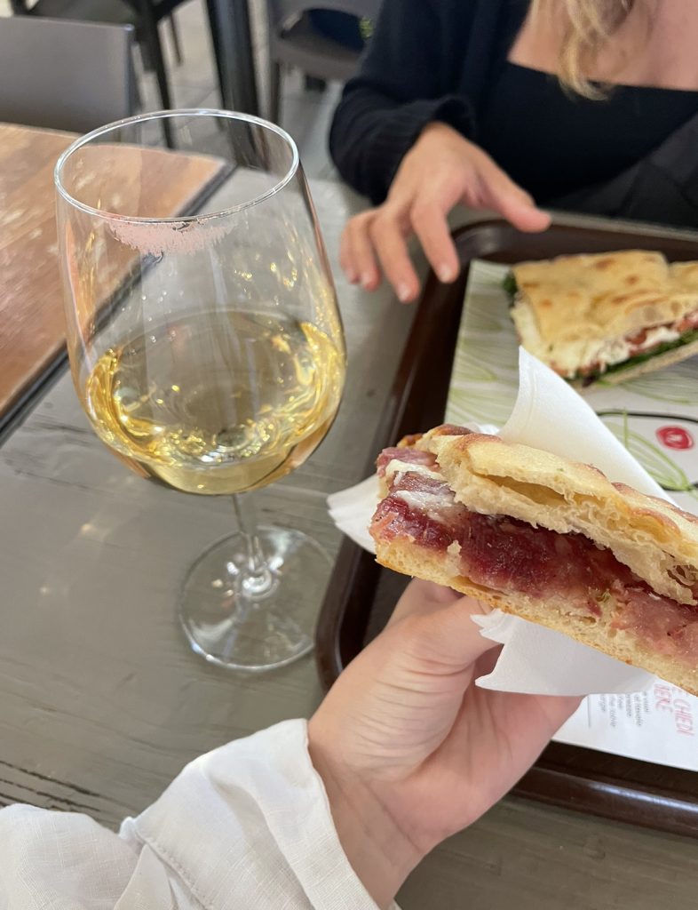 wine and a salami sandwich